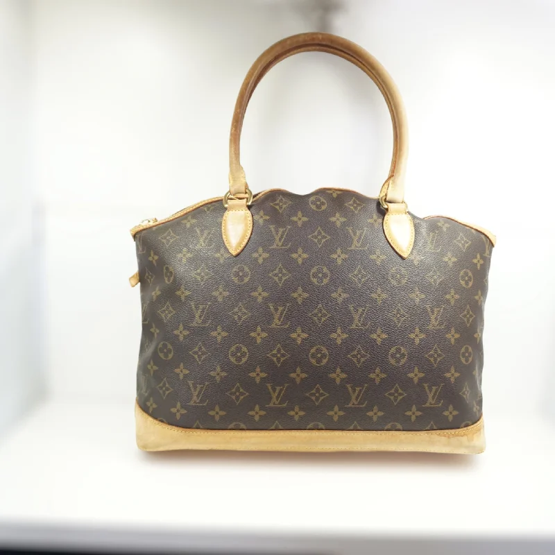 Louis Vuitton bags with a chain - link trim and a leather body for a modern edgeLouis Vuitton Lock It