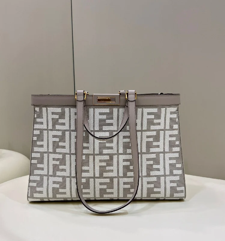 Fendi bags with a chain - link trim and a leather body for a modern and edgy lookFendi X-Tote White canvas FF bag