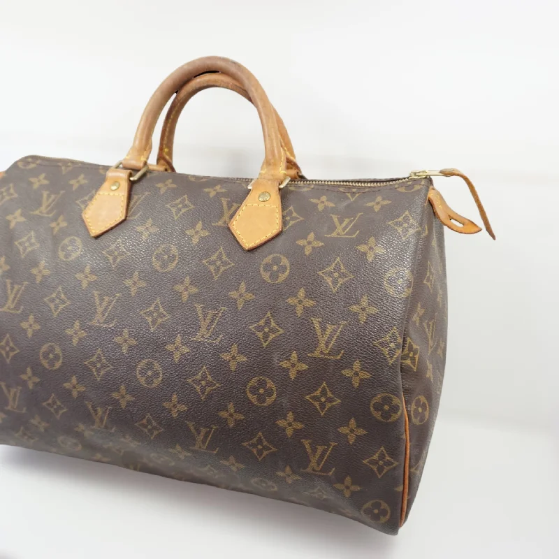 Louis Vuitton Twist bags with a snakeskin - effect panel for a bold lookLouis Vuitton Speedy