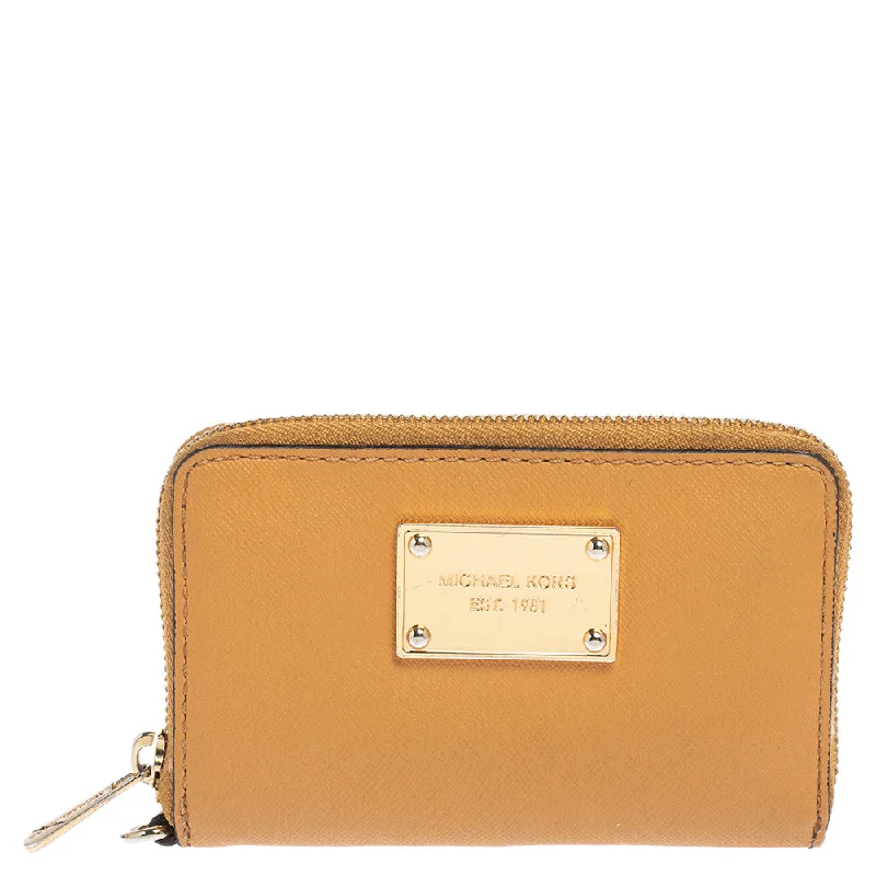 Michael Michael Kors Bags with monogrammed patterns for a personalized feelTan Leather Zip Around Wristlet Wallet.