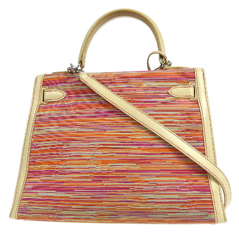 Hermès Kelly Bags with a contrast - colored interior liningHERMES * 1990s KELLY 28 SELLIER Vibrato