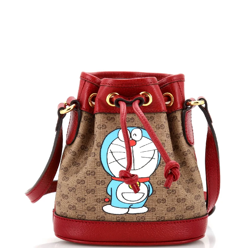 Christian Dior handbags with a snap - button closure and a decorative buckleDoraemon Bucket Bag Printed Mini GG Coated Canvas Mini